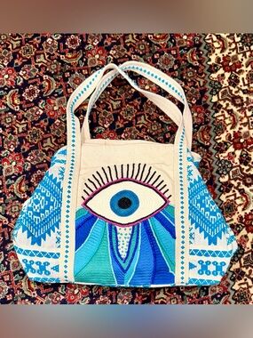 EVIL EYE TOTE BAG EMBROIDERED ZIP TOP /LINED POCKETS.